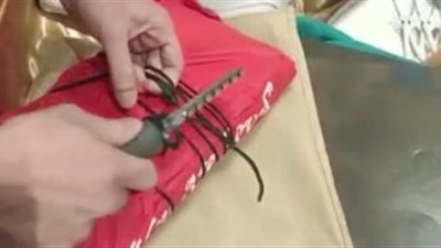 بالصور.. جمارك مطار القاهرة تضبط راكب استتخدم أفلام أشعة لإخفاء طبنجة وطلقات