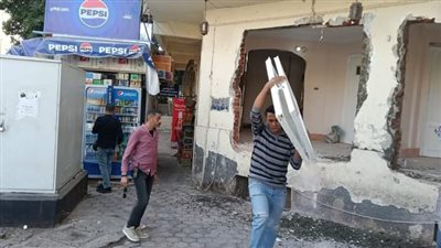 ضبط حالات تحويل عقار من الغرض السكني إلي النشاط التجاري بالدقي