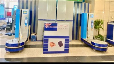 21 ماكينة تغليف حقائب بمطار القاهرة الدولي لخدمة المسافرين